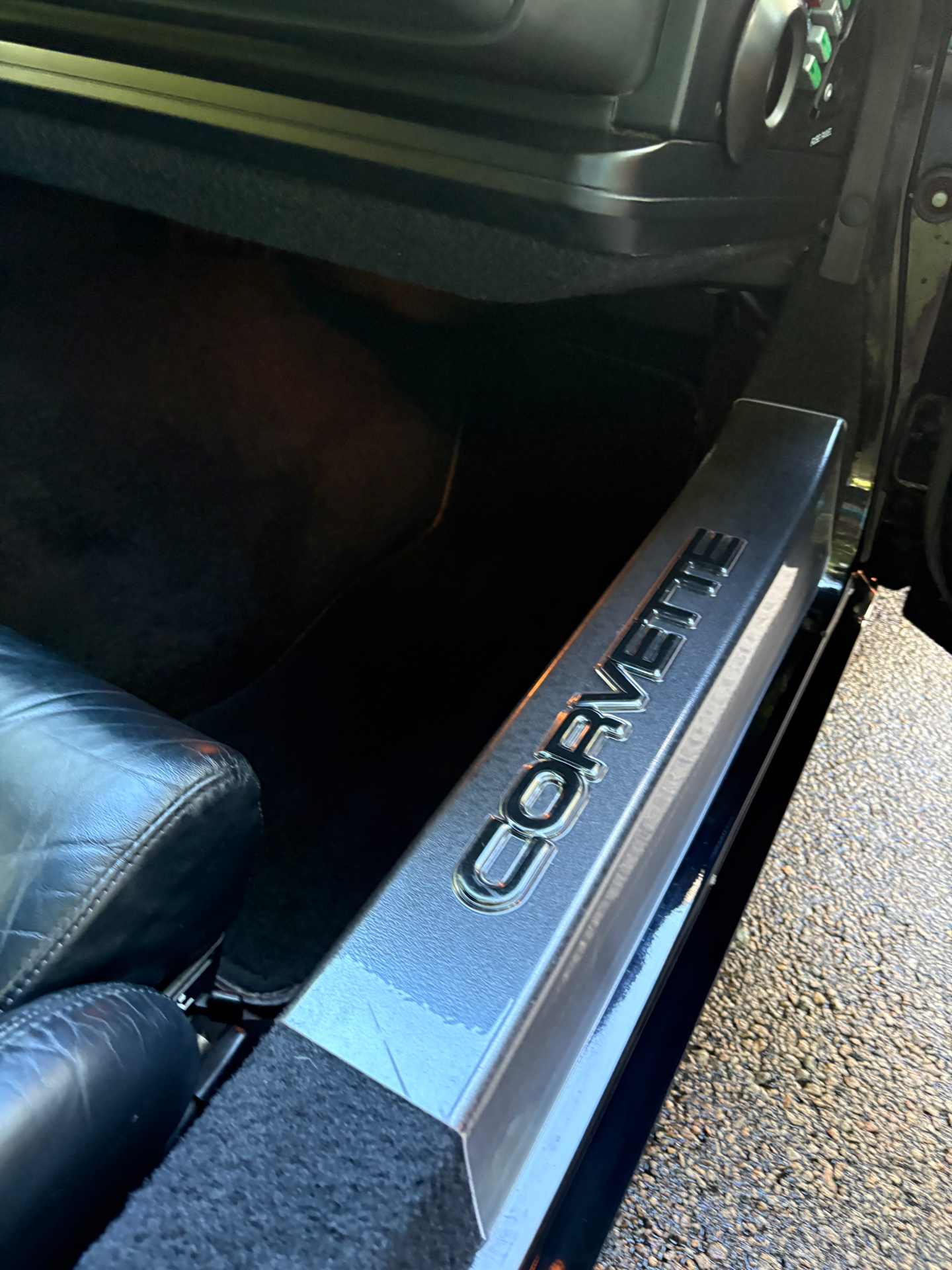 Corvette door sill with chrome lettering cleaned after interior detailing